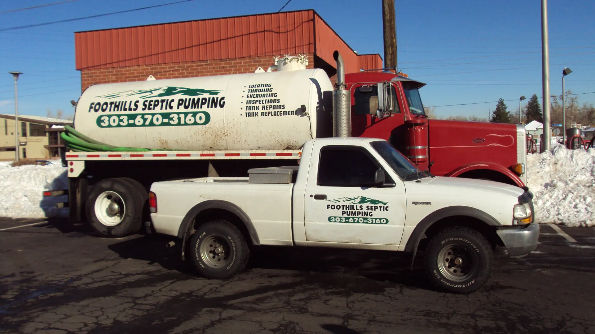 The Foothills Septic Pumping pump truck and pickup parked together in winter sun