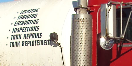 Photo of the lettering on the pump tank: Locating, Thawing, Excavating, Inspections, Tank Repairs, Tank Replacement